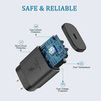 Exploded view of black charger revealing internal blue circuit board and safety feature labels for protection.