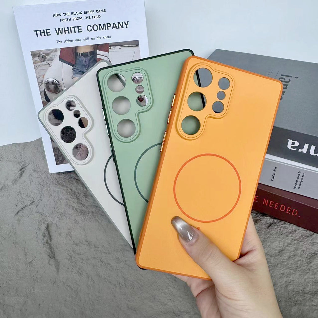 White and orange cases fanned to show dual-tone rims and circular back markings clearly